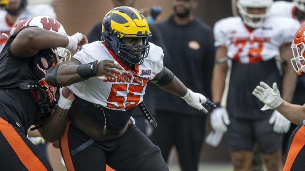 Feb 2, 2023; Mobile, AL, USA; National offensive lineman Olusegun Oluwatimi of Michigan (55) practices during the third day of Senior Bowl week at Hancock Whitney Stadium in Mobile.